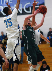 Pine Creek senior Grant Morin (12) is challenge in the air by Ralston Valley sophomore Dallas Walton (35) and senior Bryn Finnefrock during the second half Wednesday night in the opening round of the Class 5A state tournament.